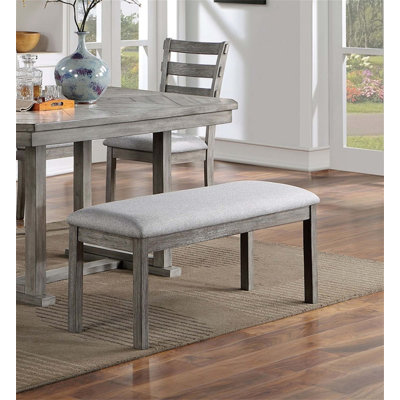 Banc de salle à manger rustique en bois massif avec siège en tissu rembourré et finition brossée au fil, parfait pour un décor de maison de campagne moderne.