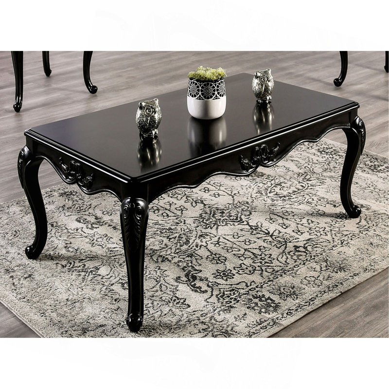 Table basse de style traditionnel avec pieds incurvés en bois massif