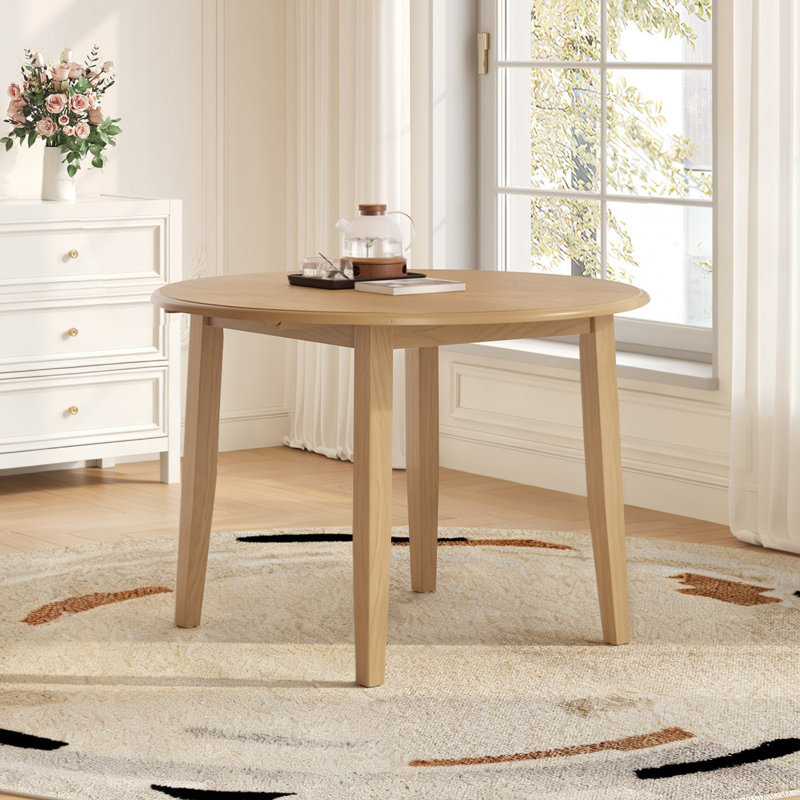 Table de salle à manger ronde extensible (table seule, sans chaises, plateau et pieds inclus) en MDF et bois d'hévéa. Style moderne et gain d'espace pour les petites cuisines.