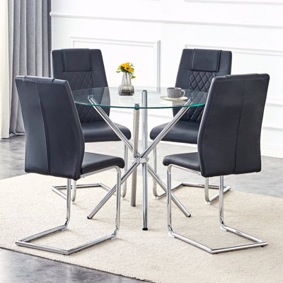 Ensemble de table et de chaises Table de salle à manger ronde en verre transparent de 36,6 po de forme unique avec des pieds en métal argenté rassemblés en forme d'anneau. Elle est accompagnée de 4 chaises de salle à manger en polyuréthane de haute