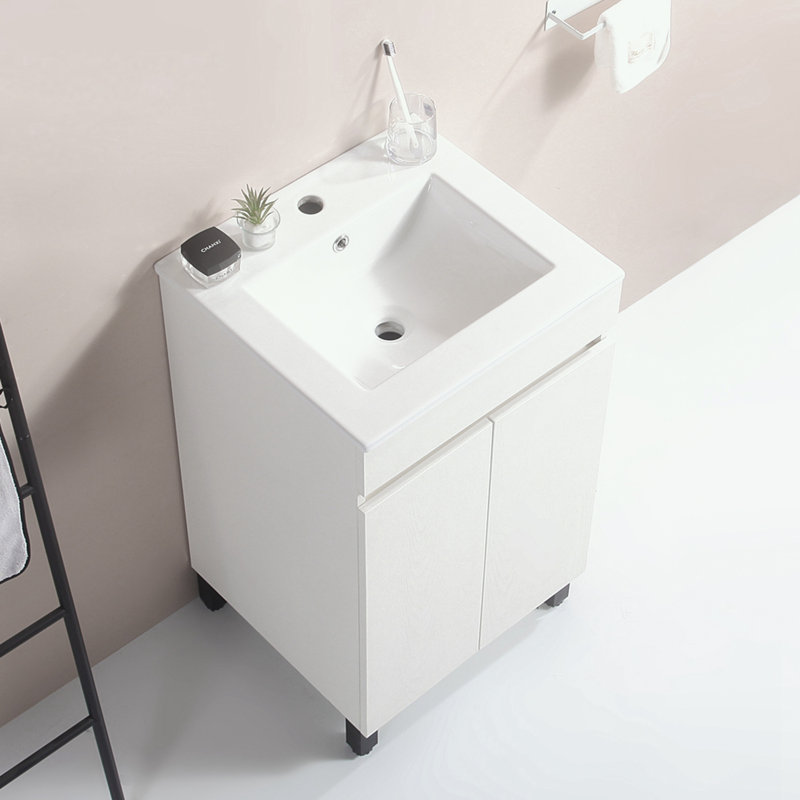 Armoire de salle de bain avec lavabo en céramique et pieds robustes