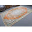 Tapis turc classique au motif médaillon floral orange, idéal pour la décoration intérieure
