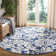 Ammundsen Floral Navy/Ivory Area Rug