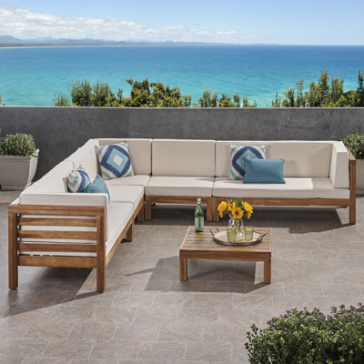Maher Outdoor 7 Piece Sectional Seating Group with Cushions