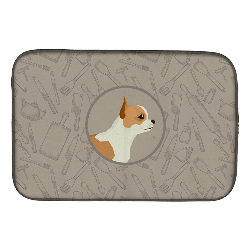 Tapis de séchage akita dans le tapis de cuisine, Chihuahua
