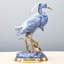 Figurine en porcelaine bleue avec aigrette et bronze
