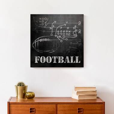 Football player holding helmet in air Black Float Frame Canvas