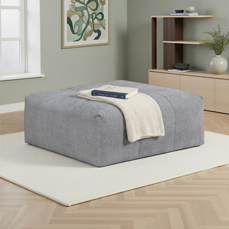 Louise 46" Modern & Contemporary Ottoman with Textured Fabric Upholstery, Elegant Tufting Details & Easy-Movement Casters
