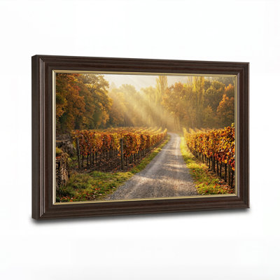 Tableau sur toile représentant des rangées de vignes d'automne sous un soleil doré