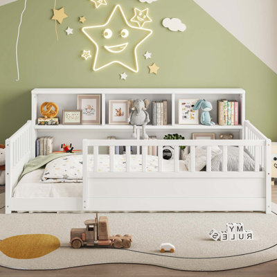 A twin-sized wooden floor bed with a fence-style guardrail, side storage decorative function, and the color is white