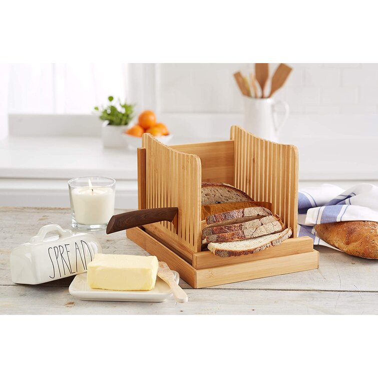 https://assets.wfcdn.com/im/98249851/resize-h755-w755%5Ecompr-r85/1683/168377084/Bread+Slicer+Guide+For+Homemade+Bread+And+Loaf+Cakes+By+Kozy+Kitchen%2C+100%25+Organic+Bamboo+Bread+Slicing+Guide%2C+Compact+Foldable+Bread+Cutter+Guide%2C+Enhanced+Bamboo+Wooden+Bagel+Slicer.jpg