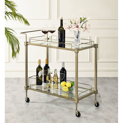 Chariot de service en miroir au fini laiton antique avec tablettes en verre à deux niveaux et quatre roulettes pour ranger la vaisselle, matériau en métal, taille de l 27 po x l 14 po, poids maximal de 40 lb, hauteur de 33 po