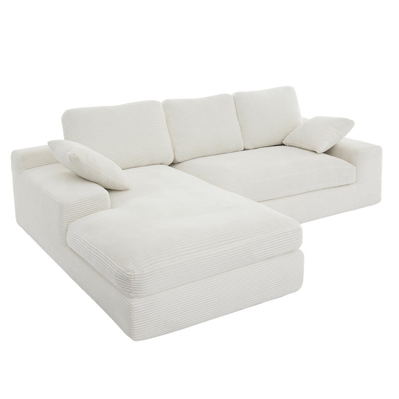 Canapé blanc en velours côtelé compressé. Il a une sensation d'assise douce et agréable pour la peau, ajoutant une atmosphère de guérison au salon chaleureux. Il est livré avec 3 coussins de dossier et 2 coussins décoratifs.
