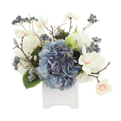 Hydrangea, Berris and Magnolia Arranged in a Ceramic Pot