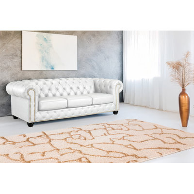 Canapé Chesterfield en cuir à accoudoirs roulés 93 po Orner