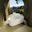 Baignoire de trempage autoportante de style colonne à surface solide avec trop-plein et drain