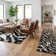 Tapis à motif imprimé animal noir Dondre