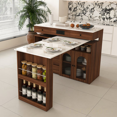 Îlot de cuisine avec table extensible et rotative, panneau de fibres à densité moyenne avec placage au design rétro, 4 tiroirs et armoires à portes en verre avec prise intégrée, station de repas extensible
