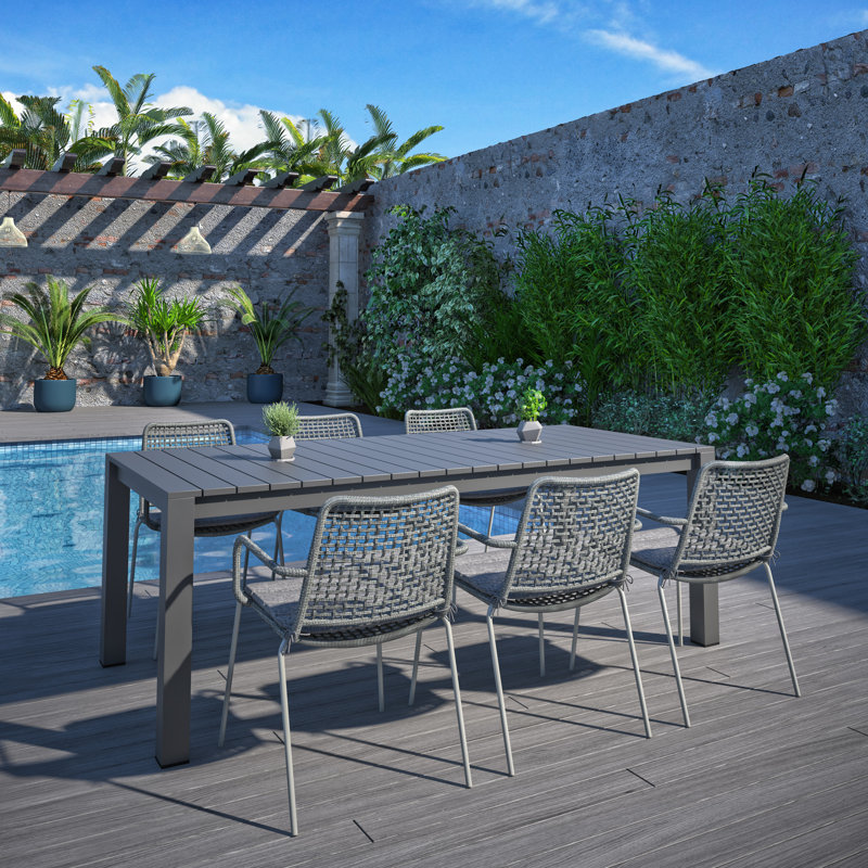 Alyisa 6 - Person Patio Dining Set Rectangular Table with Cushions Included