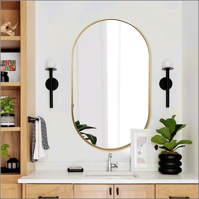 Élégant miroir ovale en métal pour les espaces modernes et contemporains, Doré