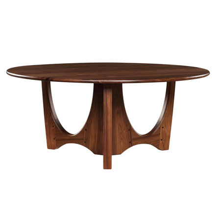 Round dark brown dining table with curved base.