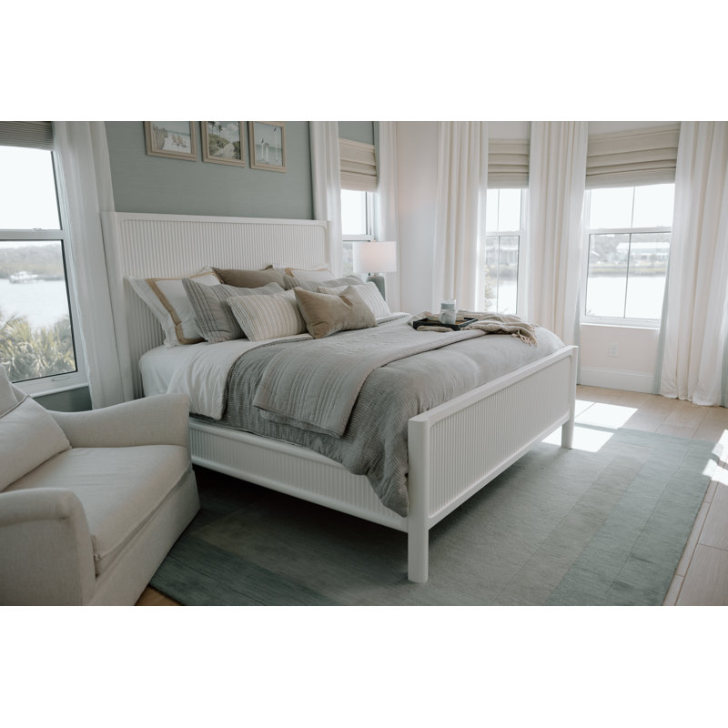 Luxurious Solid Mahogany Wood Queen Bed in Pristine White with Laser-Cut Finish, Intricate Reeded Design, Rounded Bedposts, Modern Style, and Tech-Ready Nightstand Featuring Integrated Power and USB Outlets for a Timeless Coastal Retreat
