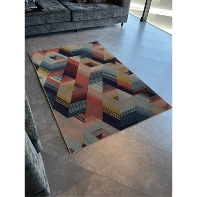 Tapis décoratif moderne multicolore à motifs géométriques aux tons clairs