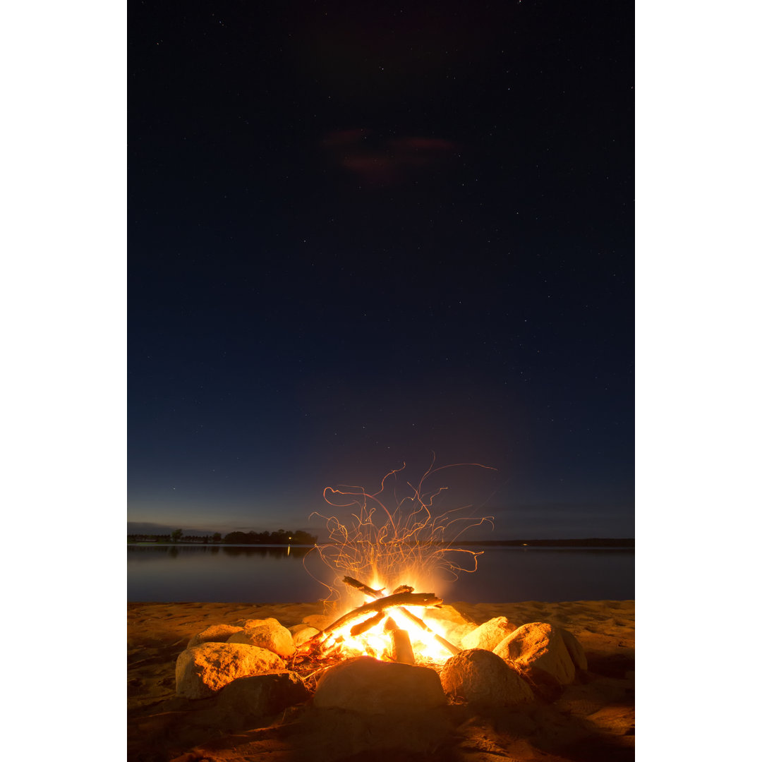 Sparking Camp Fire Beside Lake Under A Starry Sky - Wrapped Canvas Print
