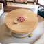 Table basse ronde moderne avec motif sculpté et pieds en métal-11240829