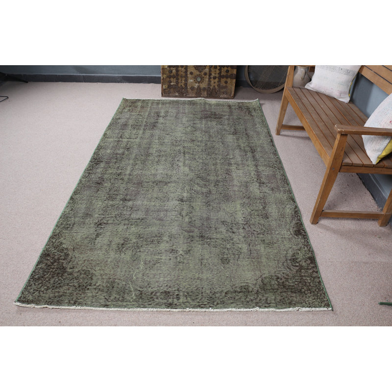 Chic tapis turc rétro vert pour rehausser l'esthétique de votre salon