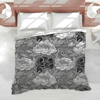 Couette à motifs floraux monochromes de pivoines