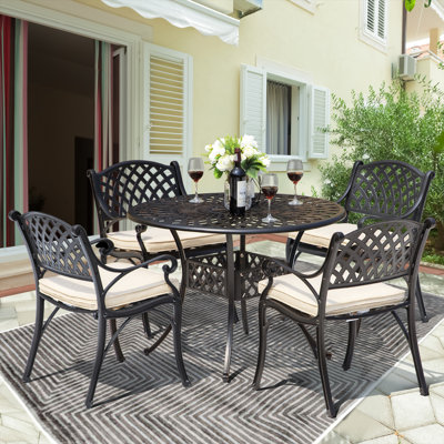 Howlett Round 4 - Person  Aluminum Dining Set with Cushions