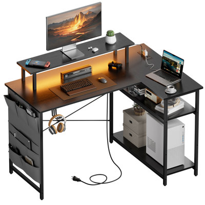 HLDIRECT 43 Inch L Shaped Computer Desk with Power Outlet, Gaming Corner Desk with LED Lights, Home Office Table with Storage Shelves & Monitor Stand for Bedroom, Black