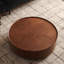 Table basse ronde avec grain de bois de noyer et base en fer