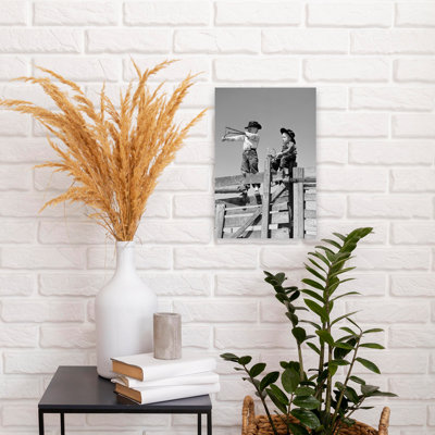 1950S Two Young Boys Dressed As Cowboys Shooting Slingshots On Top Of Wooden Fence Outdoor Classic Retro Vintage Wall Art
