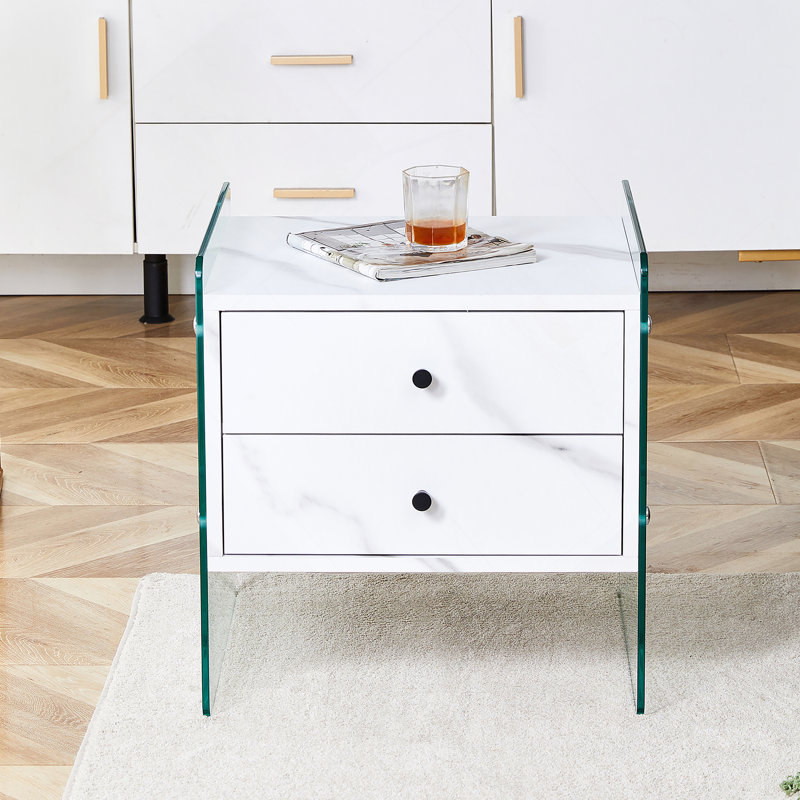 Double-drawer bedside table. The board surface is MDF with white grain sticker, and both sides are transparent tempered glass. The design is simple and elegant, with excellent storage functions.