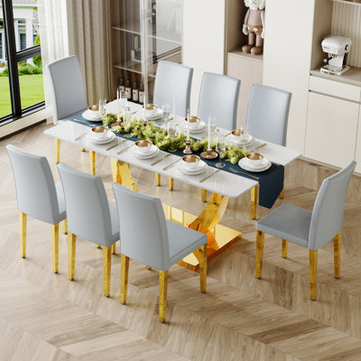 Ensemble de table de salle à manger avec plateau en verre et chaises en similicuir