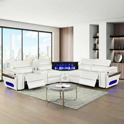 Canapé modulaire en L 4 blanc, revêtement en similicuir, structure en bois, siège mi-ferme, 2 appuis-tête réglables manuellement, coussin de recharge sans fil, ports, haut-parleur, barre éclairée à DEL, rangement pour accoudoirs 4