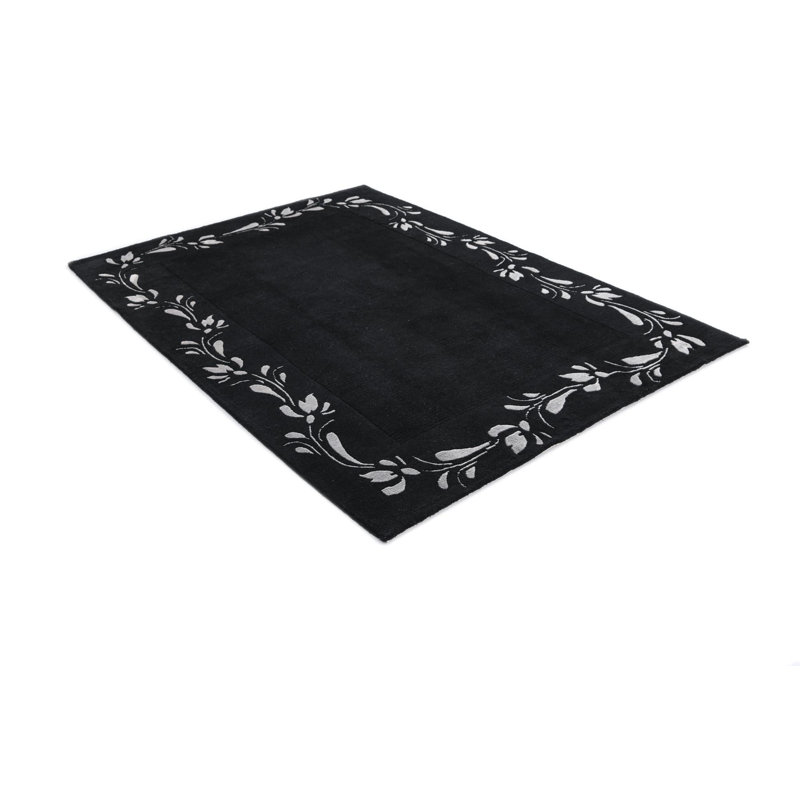 Tapis noir Iniguez