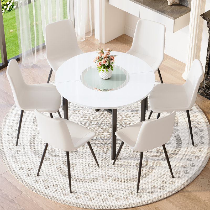 Ensemble de table de salle à manger moderne blanc avec coussins incurvés, verre et métal