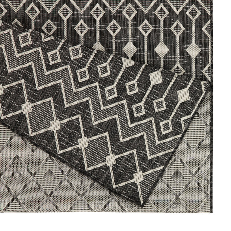 Bodhi 2'7" x 7'3" Rectangular Geometric Area Rug with Tribal Pattern
