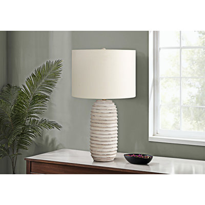 Lampe de table élégante en résine avec base crème patinée et abat-jour en lin ivoire