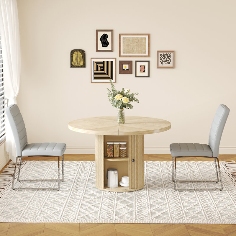 Ensemble de deux chaises rembourrées en polyuréthane avec table ronde et rangement, idéales pour les restaurants et offrant une expérience de repas confortable