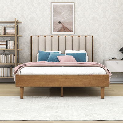 Lit plateforme en bois avec tête de lit tapissier et pieds centraux