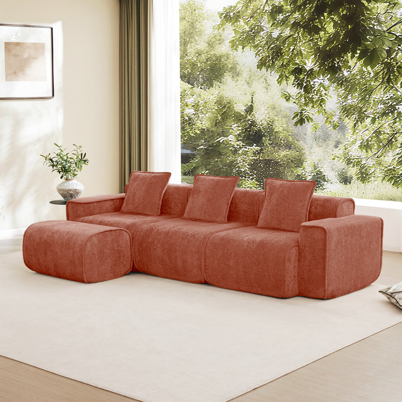 Canapé modulaire spacieux en velours rouge avec confort modulaire, idéal pour un usage domestique