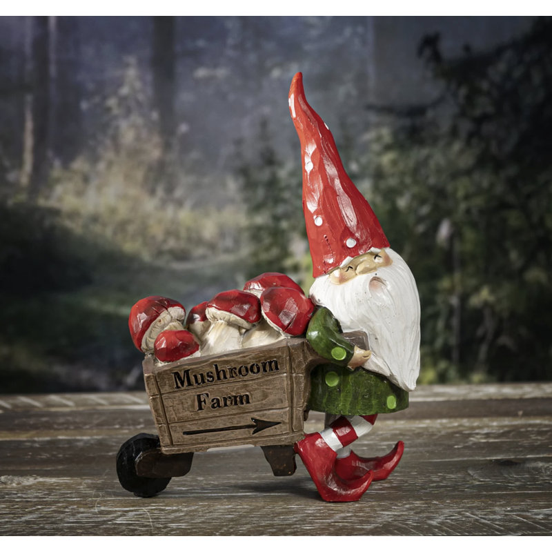 Figurine de père Noël tirant une brouette