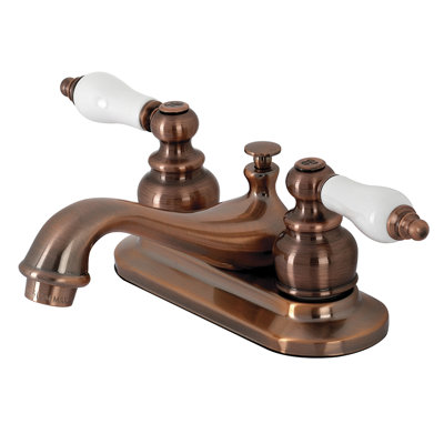 Kingston Brass Restoration Two-Handle 3-Hole Deck Mount 4" Centerset Bathroom Faucet with Plastic Pop-Up