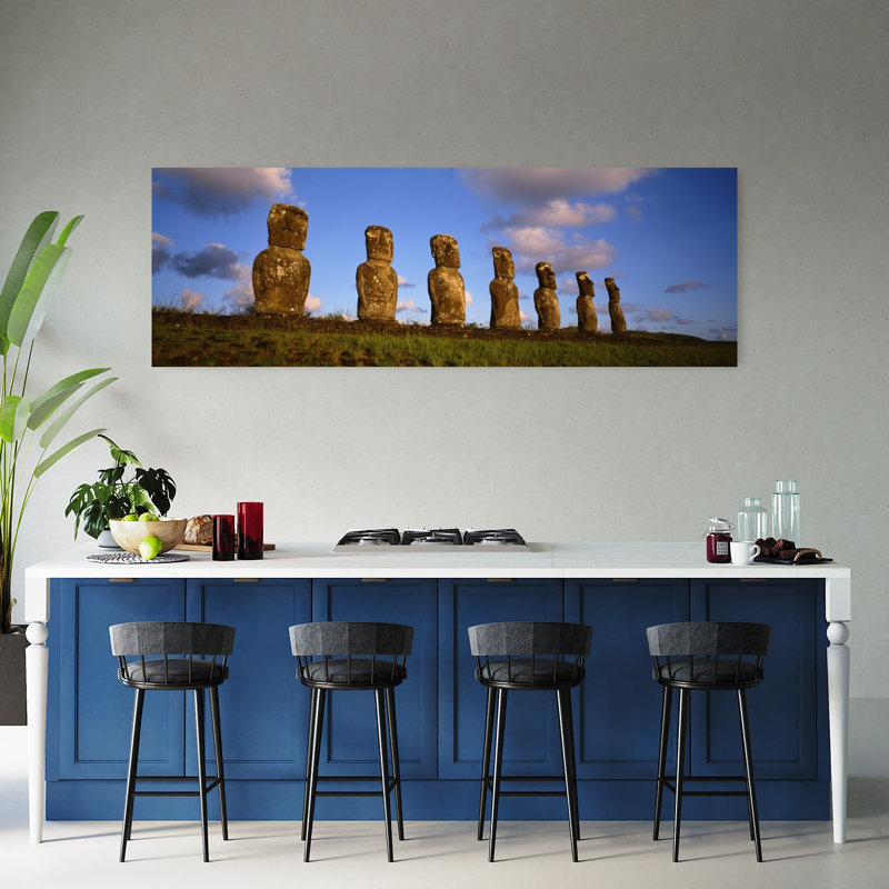 Low Angle View Of Statues In A Row Moai Statue Easter Island Chile by Kevin Schafer - Wrapped Canvas Panoramic Print