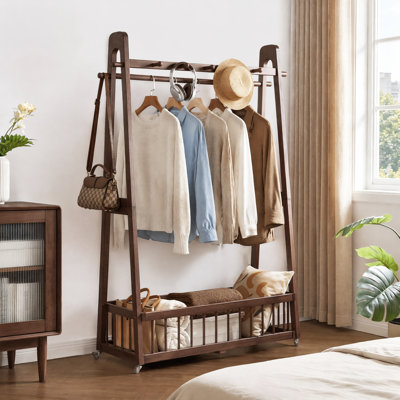 Portant à vêtements mobile en bois massif avec roulettes verrouillables, sur pied, avec barre à crochets multiples et grand panier de rangement inférieur pour garde-robe de chambre, 60 cm × 41,5 cm × 162 cm