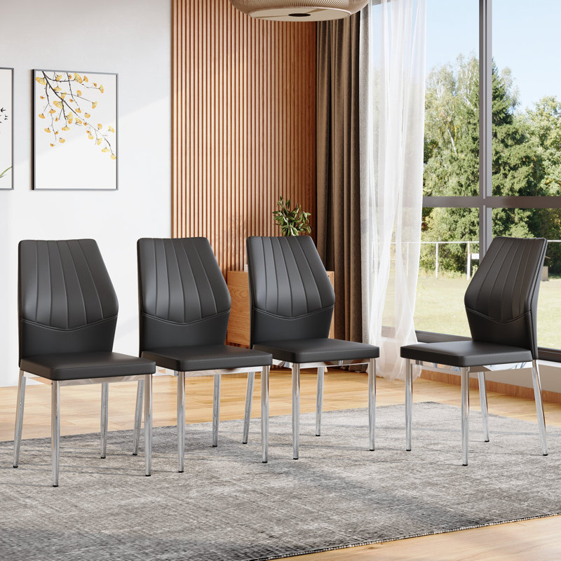 Ensemble de 4 chaises de salle à manger noires et argentées, d'une hauteur de 37 pouces: le dossier ergonomique en polyuréthane allie confort et style. Mélange parfaitement confort et élégance, ajoutant plus de confort et de style à l'heure du repas.